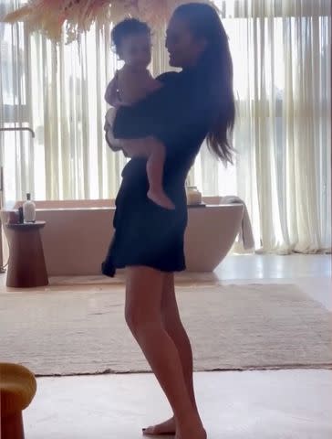 <p>Chrissy Teigen/Instagram</p> Chrissy Teigen dances with daughter Esti