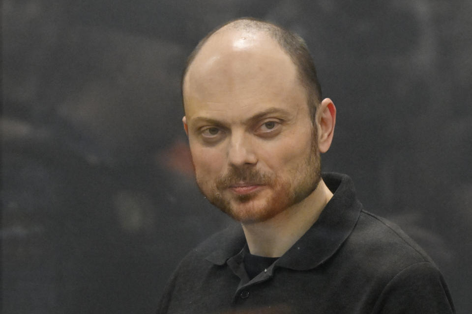 FILE - Russian opposition activist Vladimir Kara-Murza stands in a glass cage in a courtroom during announcement of the verdict on appeal at the Moscow City Court in Moscow, Russia, July 31, 2023. The prominent opposition figure survived what he believes were attempts to poison him in 2015 and 2017. He nearly died from kidney failure in the first instance and suspects poisoning but no cause was determined. He was hospitalized with a similar illness in 2017 and put into a medically induced coma. His wife said doctors confirmed he was poisoned. (AP Photo/Dmitry Serebryakov, File)