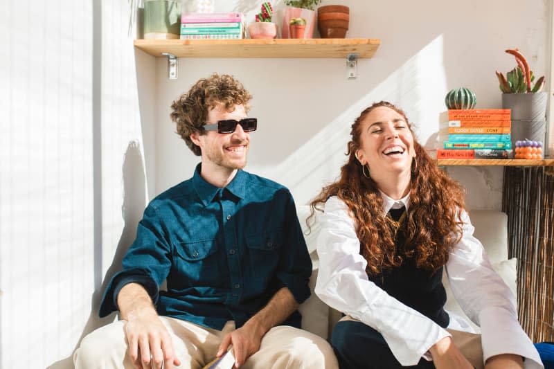 Dwellers pose for a photo in their sunroom.