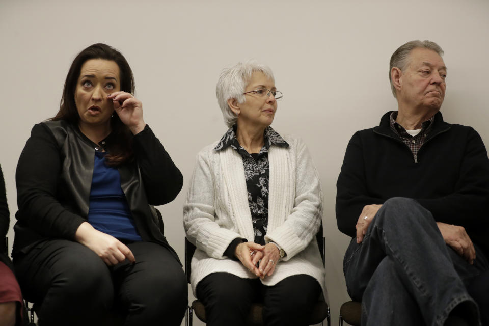 Sister Angela, left, mother Sandra, and father Dimmon of U.S. tourist Melissa Cochran, who was injured and whose husband, Kurt Cochran, was killed in Wednesday's London attack, listen during a press conference with family members at New Scotland Yard, the headquarters of the Metropolitan Police force, in London, Monday, March 27, 2017. (AP Photo/Matt Dunham)