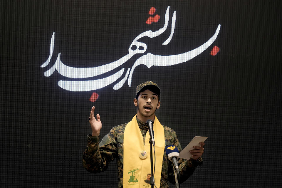 Hussein, son of senior Hezbollah commander Taleb Sami Abdullah, 55, who was killed last week by an Israeli strike in south Lebanon, speaks during a ceremony to commemorate the death of his father, in the southern Beirut suburb of Dahiyeh, Lebanon, Wednesday, June 19, 2024. (AP Photo/Bilal Hussein)