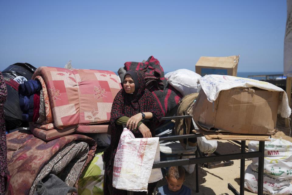 Displaced Palestinians arrive in central Gaza after fleeing from the southern Gaza city of Rafah in Deir al Balah, Gaza Strip, on Thursday, May 9, 2024. The Israeli army has ordered tens of thousands of people to evacuate Rafah as it conducts a ground operation there. (AP Photo/Abdel Kareem Hana)