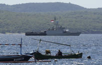 Indonesian Navy ship KRI Singa sails to take part in the search for submarine KRI Nanggala that went missing while participating in a training exercise on Wednesday, off Banyuwangi, East Java, Indonesia, Thursday, April 22, 2021. Indonesia's navy ships are intensely searching the waters where one of its submarines was last detected before it disappeared, as neighboring countries are set to join the complex operation. (AP Photo)