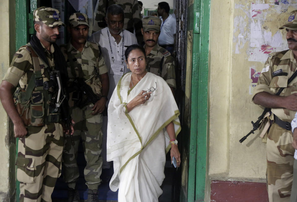 Trinamool Congress party leader and Chief Minister of West Bengal state Mamata Banerjee gestures as she comes out after casting her vote at a polling station during the final phase of national elections in Kolkata , India, Sunday, May 19, 2019. Indians voted in the seventh and final phase of national elections Sunday, wrapping up a 6-week-long grueling campaign season with Prime Minister Narendra Modi's Hindu nationalist party seeking reelection for another five years. (AP Photo/Bikas Das)