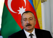 FILE PHOTO: Azerbaijan President Ilham Heydar Oglu Aliyev poses at the opening of talks with Armenia in Geneva, Switzerland October 16, 2017. REUTERS/Denis Balibouse/File Photo