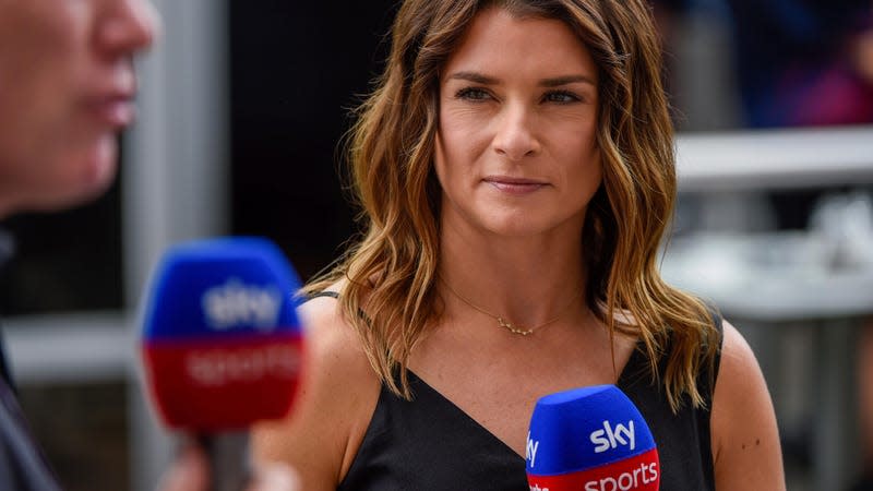 Danica Patrick chats with Sky Sports near the garage area before the Aramco U.S. Grand Prix at Circuit of the Americas on October 24, 2021 in Austin, TX