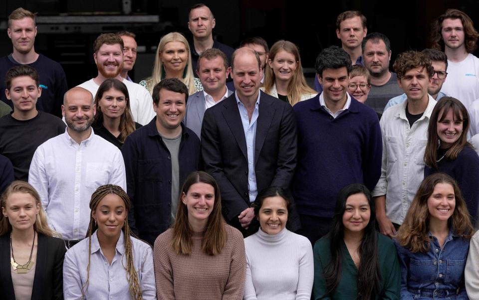 Prince William, Prince of Wales with staff members as he visits after visiting last November Earthshot Prize winner - KIN CHEUNG