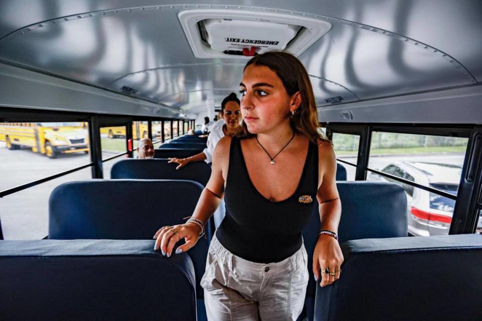 Holly Thorpe, 16, a rising junior at MAST Academy and an advocate for clean transportation since sixth grade, tours a new electric bus as part of the Miami-Dade County Public Schools fleet of nearly 1,000 vehicles in Miami on Tuesday, Aug. 15, 2023. She was instrumental in school district turning green. MDCPS bought 20 electric buses this year and plans to buy 30 others by 2025.