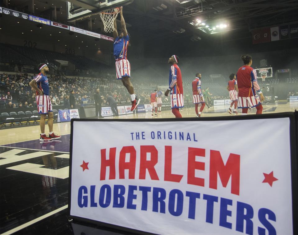 The Harlem Globetrotters warm up before the start of their game during their Harlem Globetrotters' Pushing the Limits World Tour stop at Stockton Arena in downtown Stockton. [CLIFFORD OTO/THE RECORD]