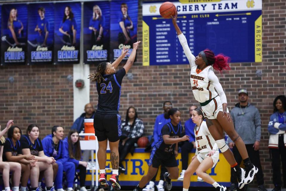 Frederick Douglass’ Ayanna-Sarai Darrington, right, blocks a shot by Henry Clay’s Timarri Miller during the 42nd District Tournament championship game.