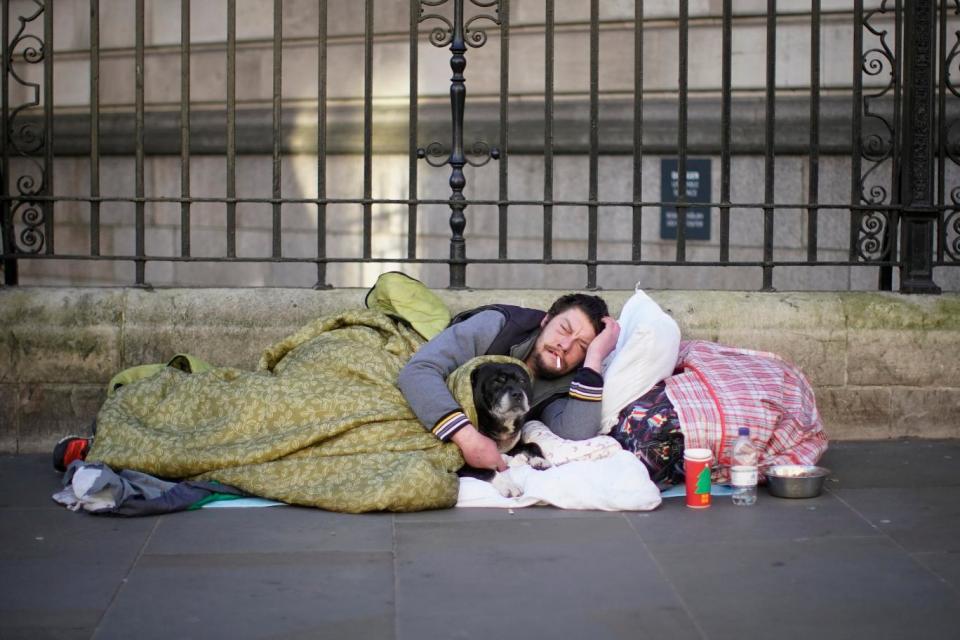 A homeless man sleeps on the street in central London (Christopher Furlong/Getty Images)