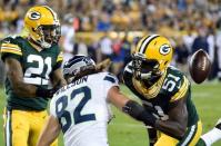 Green Bay Packers linebacker Nate Palmer (51) and safety Ha Ha Clinton-Dix (21) breaks up a pass intended for Seattle Seahawks tight end Luke Willson (82) in the fourth quarter at Lambeau Field. Sep 20, 2015; Green Bay, WI, USA. Benny Sieu-USA TODAY Sports