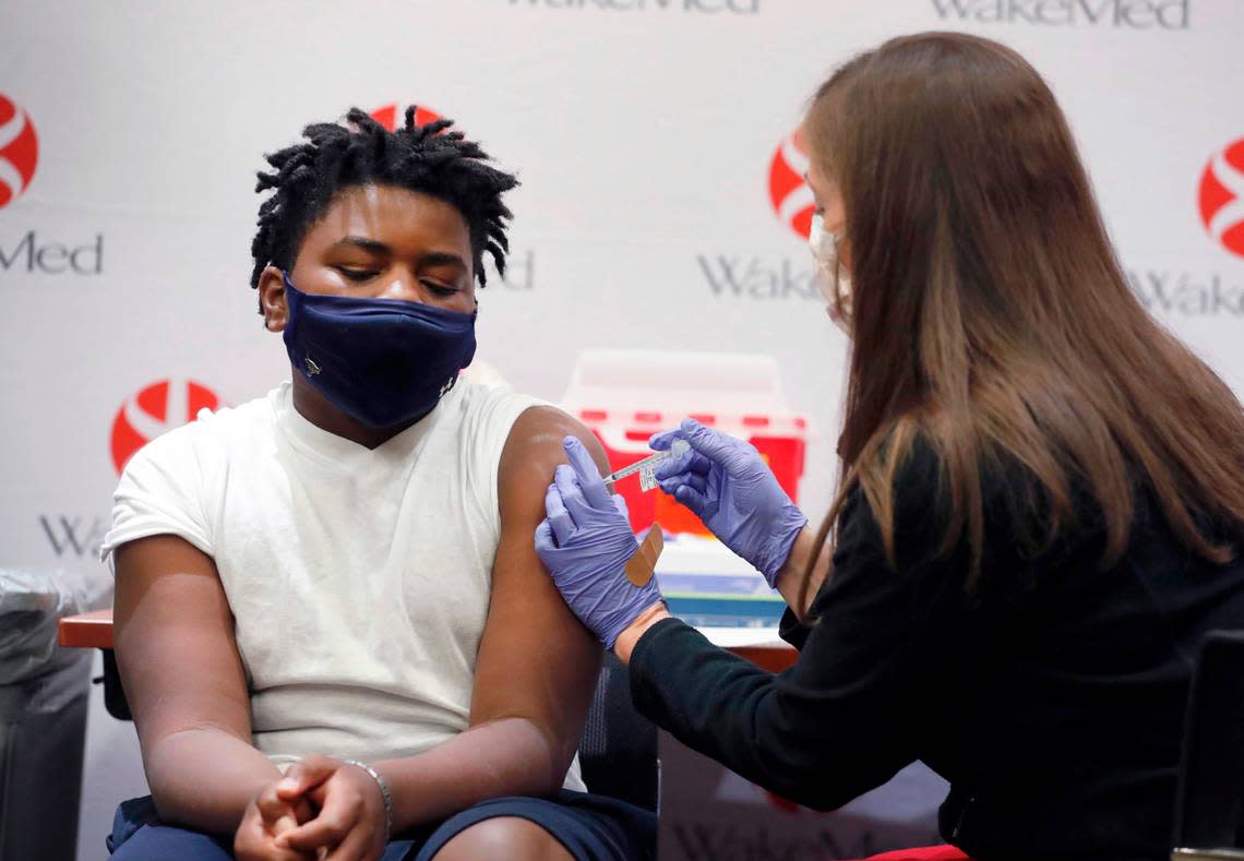 Gavin McLawhorn, 12, of Wake Forest receives his first COVID-19 vaccine shot at WakeMed Raleigh Campus on May 13, 2021. New research from Iowa State University suggests that exercising after getting the COVID-19 vaccine could boost the body’s immune response. Ethan Hyman/ehyman@newsobserver.com