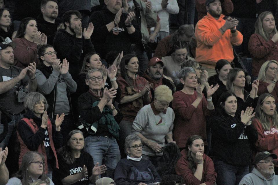 Onaway Cardinals basketball supporters give senior Jadin Mix a standing ovation after Mix fouled out during the final minutes of Onaway's regional semifinal clash with St. Ignace at Inland Lakes on Tuesday.