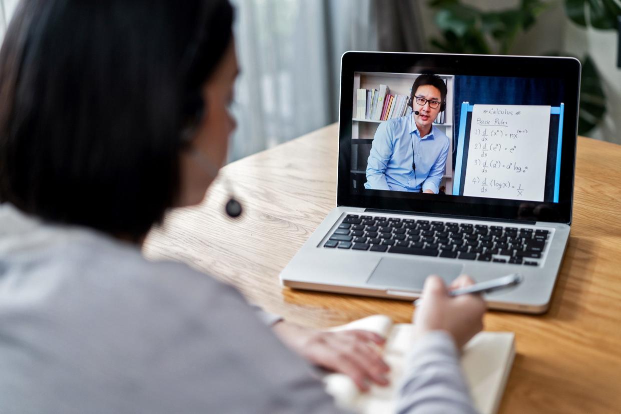 A student attending a virtual classroom with instruction from a remote teacher.