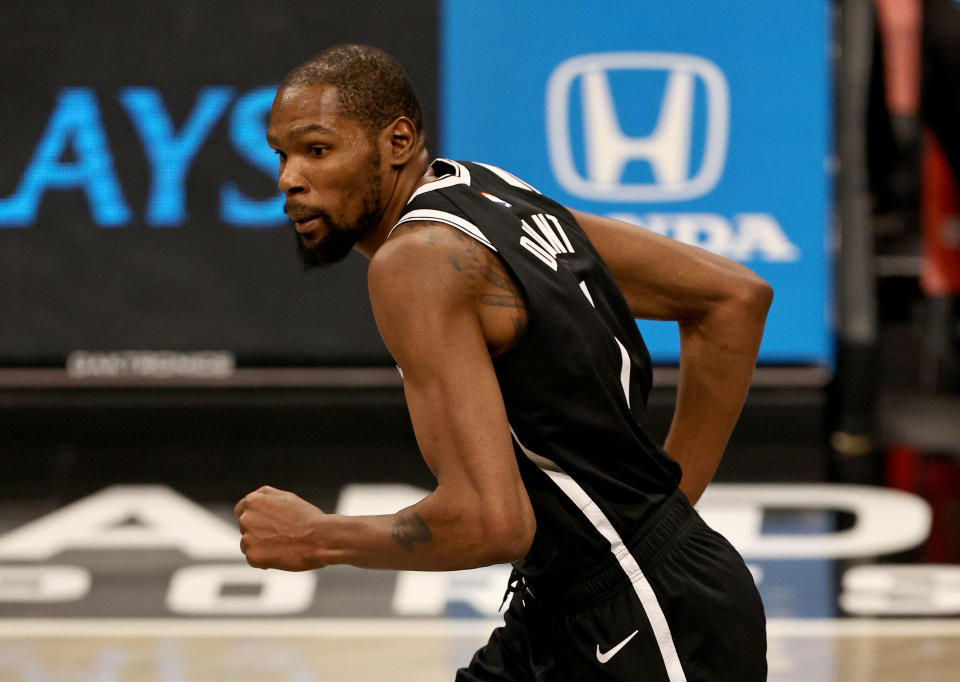 NEW YORK, NEW YORK - JANUARY 23:  Kevin Durant #7 of the Brooklyn Nets celebrates his shot in the second half against the Miami Heat at Barclays Center on January 23, 2021 in New York City.NOTE TO USER: User expressly acknowledges and agrees that, by downloading and or using this photograph, User is consenting to the terms and conditions of the Getty Images License Agreement. (Photo by Elsa/Getty Images)