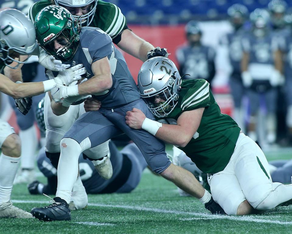 Duxbury's Thomas Sheehan brings down Grafton's TJ Cahill during second quarter action of their game against Grafton in the Division 4 Super Bowl at Gillette Stadium in Foxborough on Friday, Dec. 2, 2022. 