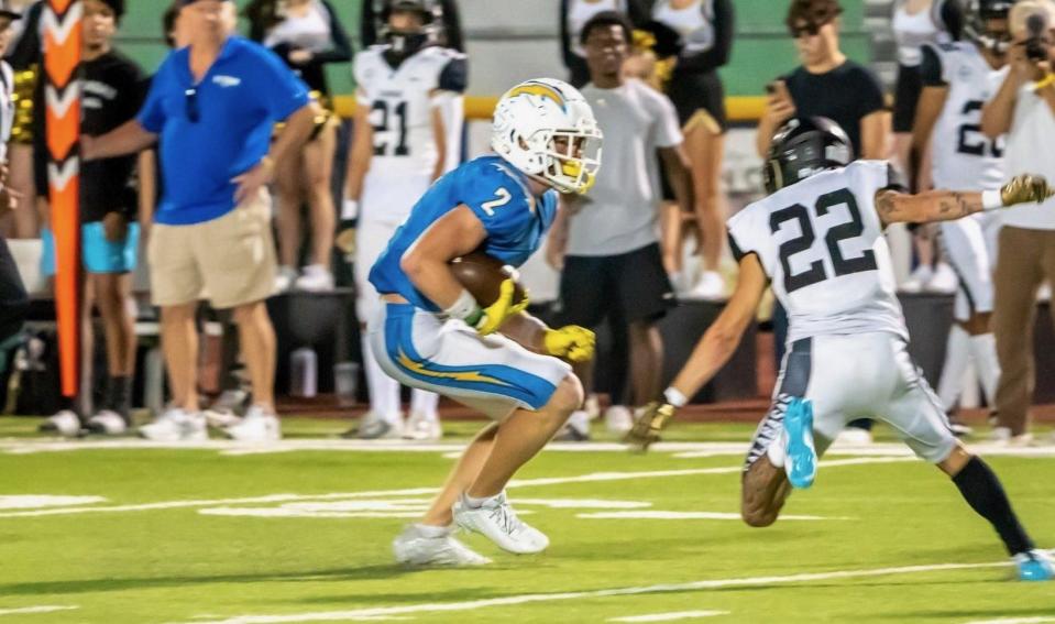 Agoura's Miles Hull tries to avoid Calabasas' Josh Nazmiyev during the Chargers' 54-53 overtime win in a nonleague home on Friday, Sept. 8, 2023.