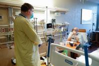 Robert M. Klinestiver, MD, the Medical Director of Pulmonary and Respiratory Services for Hancock Regional Hospital, checks on his Covid-19 patient, Mark Green, on Friday, Sept. 24, 2021, at Hancock Regional Hospital, Greenfield Ind.