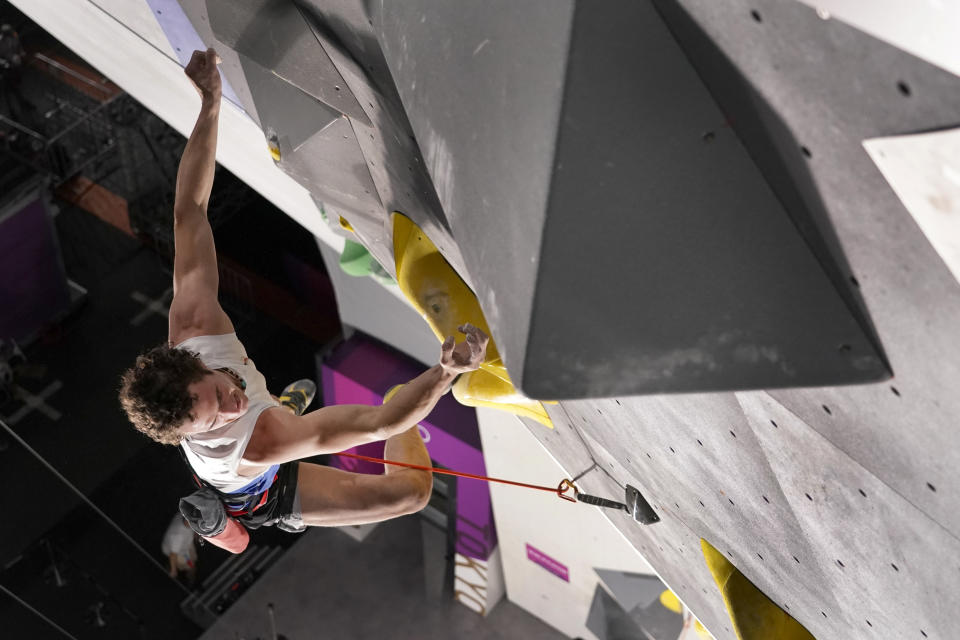 Adam Ondra, of the Czech Republic, looses his grip and falls as he nears the top during the lead qualification portion of the men's sport climbing competition at the 2020 Summer Olympics, Tuesday, Aug. 3, 2021, in Tokyo, Japan. (AP Photo/Jeff Roberson, POOL)