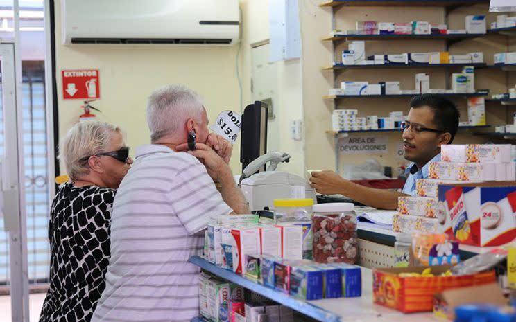 Two Americans are being helped at a pharmacy in Nogales, Mexico, in 2015. (Photo: Alicia Clark/Cronkite News)