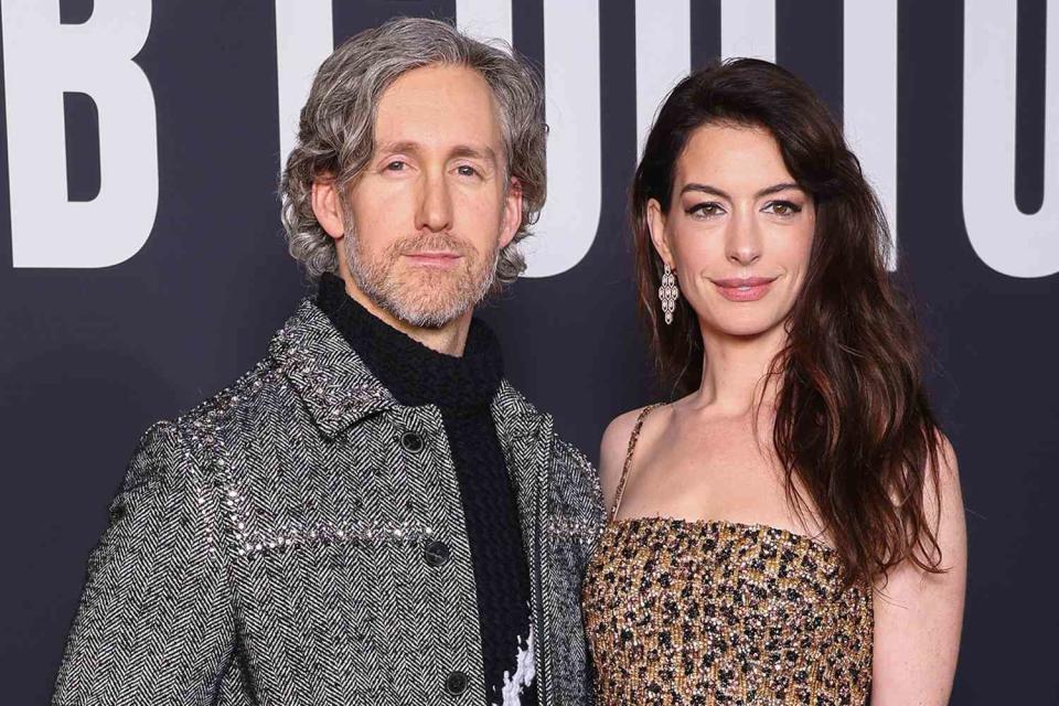 <p>Pascal Le Segretain/Getty</p> Adam Shulman (L) and Anne Hathaway (R)