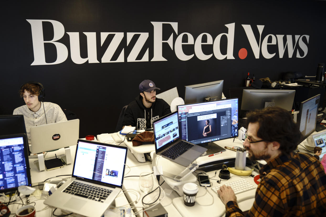 Members of the BuzzFeed News team work at their desks at BuzzFeed headquarters in New York. Employees at the internet media and news company have been demanding that management recognize their union. (Photo: Drew Angerer via Getty Images)