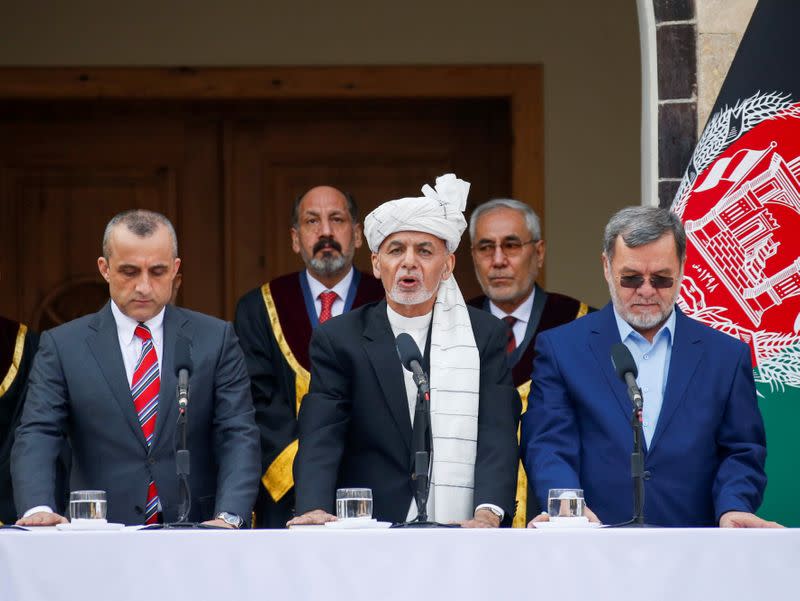 Afghanistan's President Ashraf Ghani, his first Vice President Amrullah Saleh (L) and second Vice President Sarwar Danish (R) taken an oath during their inauguration, in Kabul