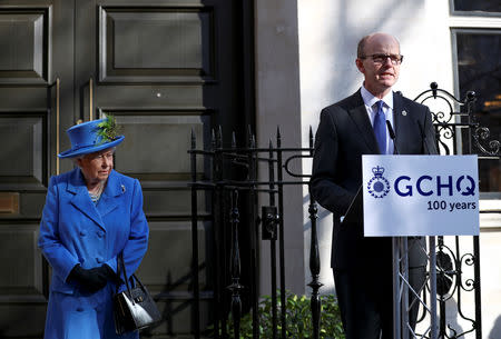 Britain's Queen Elizabeth listens to GCHQ Director Jeremy Fleming as she visits Watergate House to mark the centenary of the GCHQ (Government Communications Head Quarters) in London, Britain, February 14, 2019. REUTERS/Hannah McKay/Pool