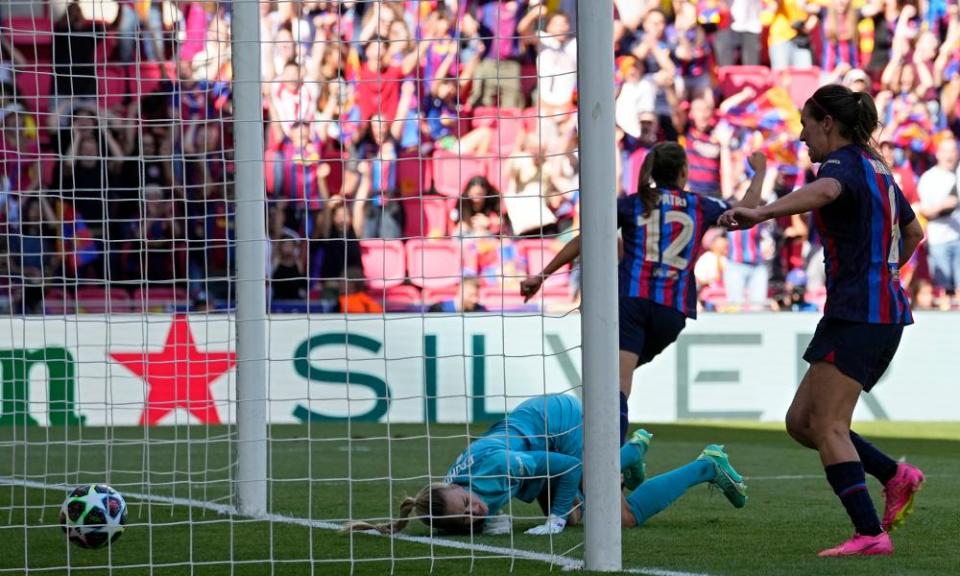 Merle Frohms falls to the ground after Patri Guijarro scores Barcelona’s second goal.