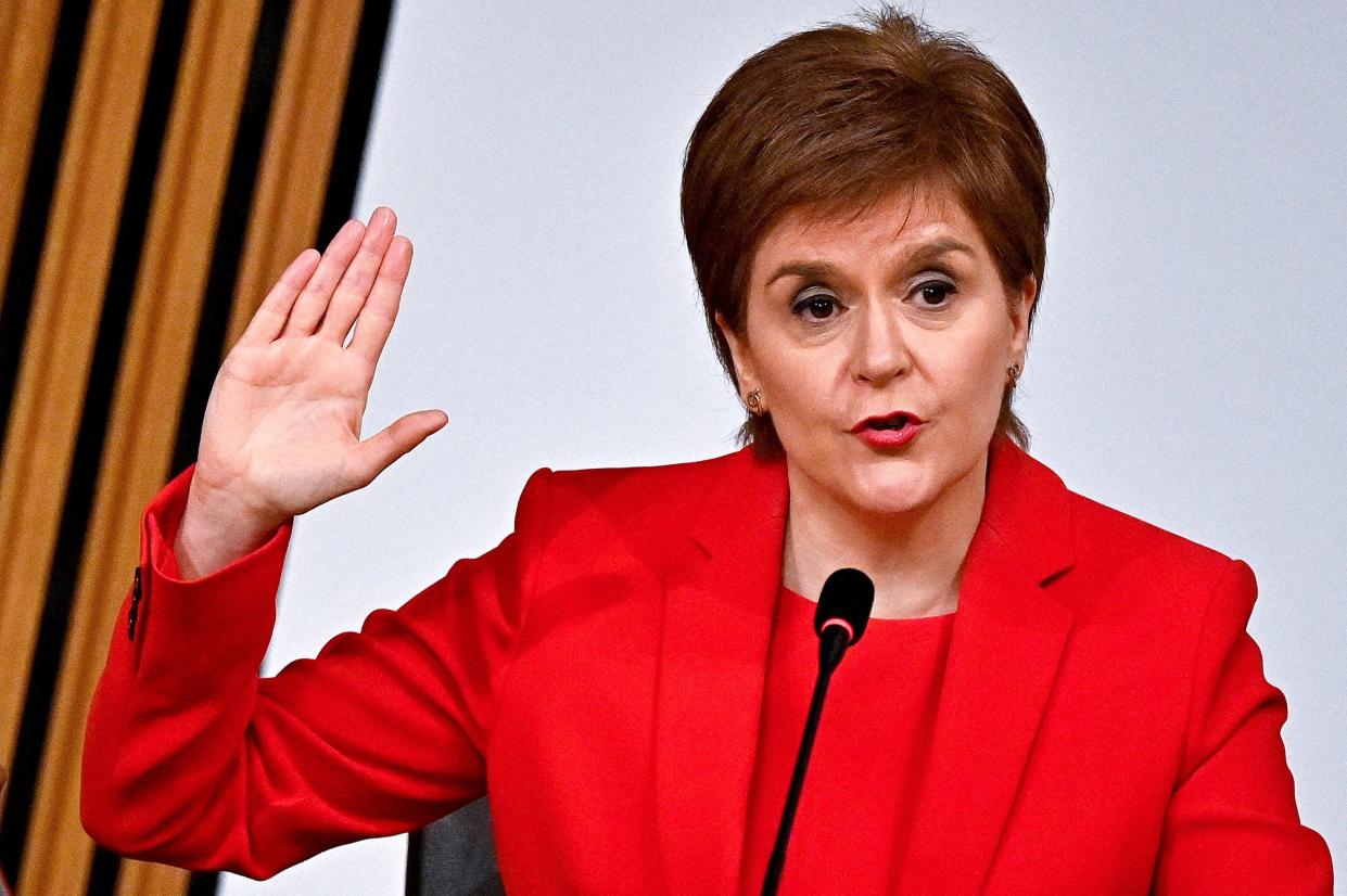 <p>Scotland's First Minister Nicola Sturgeon is sworn in before giving evidence to the committee</p> (POOL AFP via Getty Images)