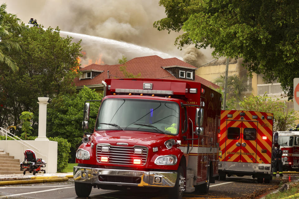 Miami Fire Rescue and Miami police work at the scene of the fire at the Temple Court Apartments, Monday, June 10, 2024 in Miami. (Carl Juste/Miami Herald via AP)