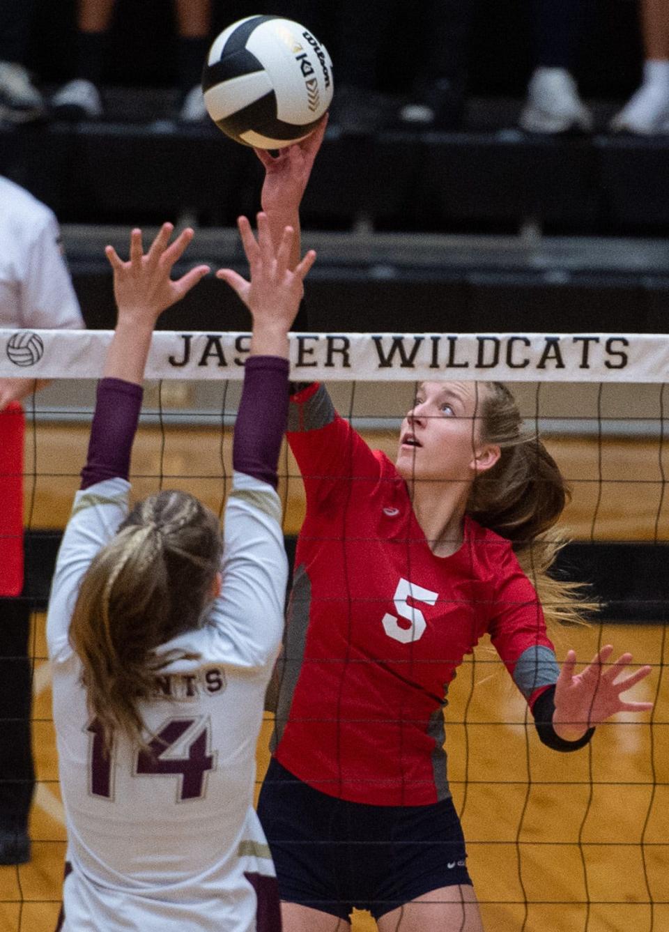 Tecumseh’s Katelyn Marx (5) hits against Indianapolis Lutheran’s Regan Wilson (14) during the Class A semi state volleyball game at Jasper High School in Jasper, Ind., Saturday afternoon, Oct. 29, 2022. 