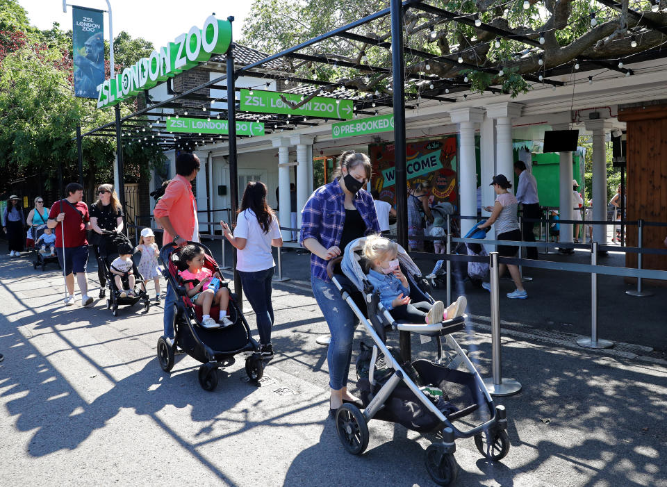 People queue to enter London Zoo as it reopens on Monday.