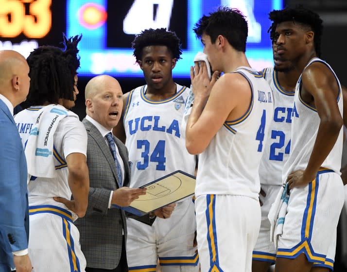 LOS ANGELES, CA - FEBRUARY 29: Tyger Campbell #10, David Singleton #34, Jaime Jaquez Jr. #4, Jalen Hill #24 and Chris Smith #5 of the UCLA Bruins listen as head coach Mick Cronin talks during a timeout in the second half of the game against the Arizona Wildcats at Pauley Pavilion on February 29, 2020 in Los Angeles, California. (Photo by Jayne Kamin-Oncea/Getty Images) ** OUTS - ELSENT, FPG, CM - OUTS * NM, PH, VA if sourced by CT, LA or MoD **