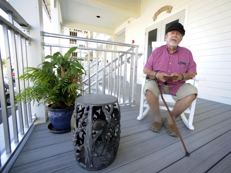 Tom Wood, owner of the Driftwood Inn in Mexico Beach, Fla., sits outside the hotel, Tuesday, Oct. 11, 2022. Destroyed by Hurricane Michael four years ago, the hotel reopened earlier this year. (AP Photo/Jay Reeves)