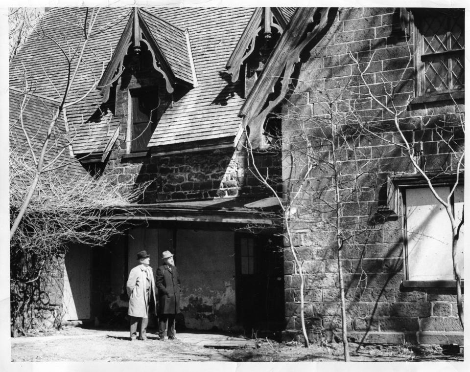 Two men standing outside the Hermitage, Ho-Ho-Kus.