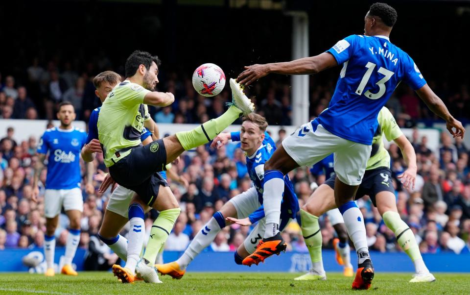 Manchester City's Ilkay Gundogan, center left, scores his side's opening goal - AP Photo/Jon Super