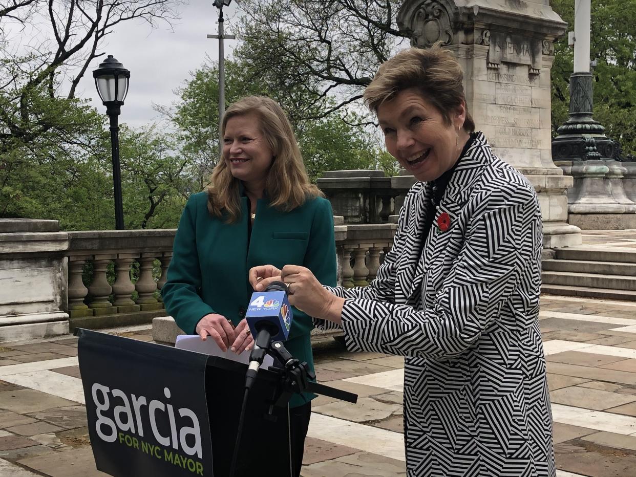 Kathryn Garcia (left) gets Loree Sutton's endorsement for mayor at the Soldiers and Sailors Monument on Tuesday.