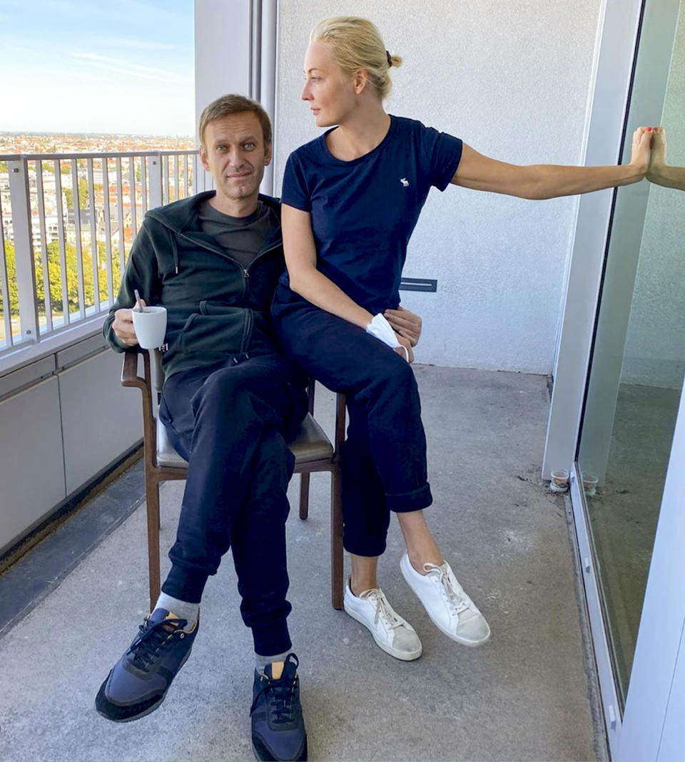 In this photo published by Russian opposition leader Alexei Navalny on his Instagram account on Monday, Sept. 21, 2020, Russian opposition leader Alexei Navalny and his wife Yulia pose for a photo in a hospital in Berlin. Navalny on Monday demanded that Russia returned clothes he was wearing on the day he fell into a coma, calling it a “crucial piece of evidence” of a suspected nerve agent poisoning he is being treated for at the German hospital. (Navalny Instagram via AP)