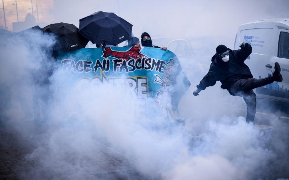 Demonstrators clash with anti riot police