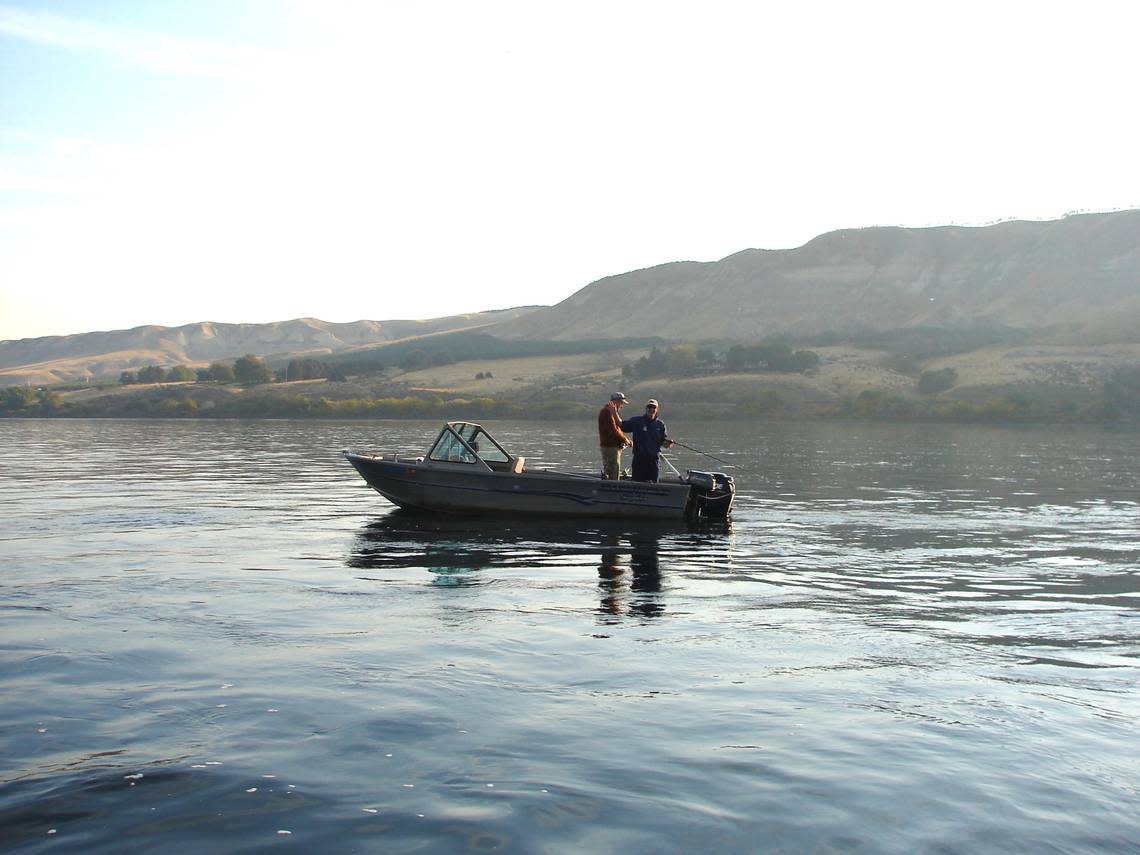 FishermanReach- Two anglers backtroll for salmon in a deep hole near Taylor Flats on a calm October day.