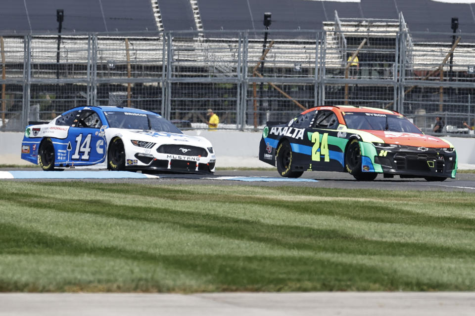 William Byron (24) and Chase Briscoe (14) drive duringa NASCAR Series auto race at Indianapolis Motor Speedway, Sunday, Aug. 15, 2021, in Indianapolis. (AP Photo/Rob Baker)