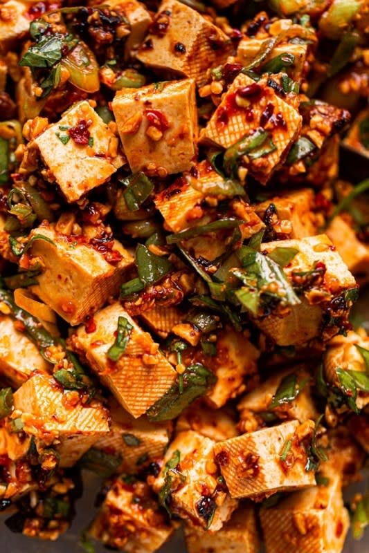 <p>A Beautiful Plate</p><p>This spicy tofu dish comes together in less than 15 minutes, but you’ll want to marinate it in the refrigerator for several hours (or, preferably, 12 to 24 hours) before serving. </p><p><strong>Get the recipe here: <a href="https://www.abeautifulplate.com/easy-spicy-tofu/" rel="nofollow noopener" target="_blank" data-ylk="slk:Spicy Chili Crisp Tofu;elm:context_link;itc:0;sec:content-canvas" class="link ">Spicy Chili Crisp Tofu</a></strong></p>