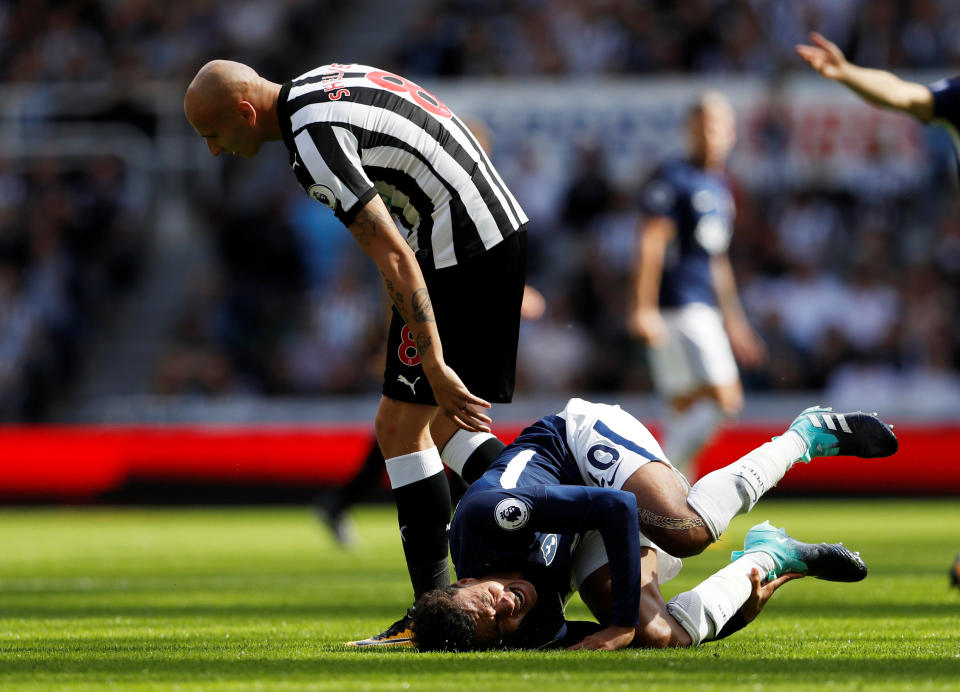 Dele Alli reacts to Jonjo Shelvey’s stamp. (Reuters)