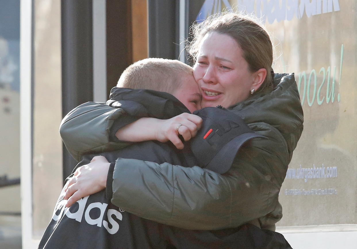 Azovstal steel plant employee Valeria, last name withheld, evacuated from Mariupol, hugs her son Matvey, who had earlier left the city with his relatives. 