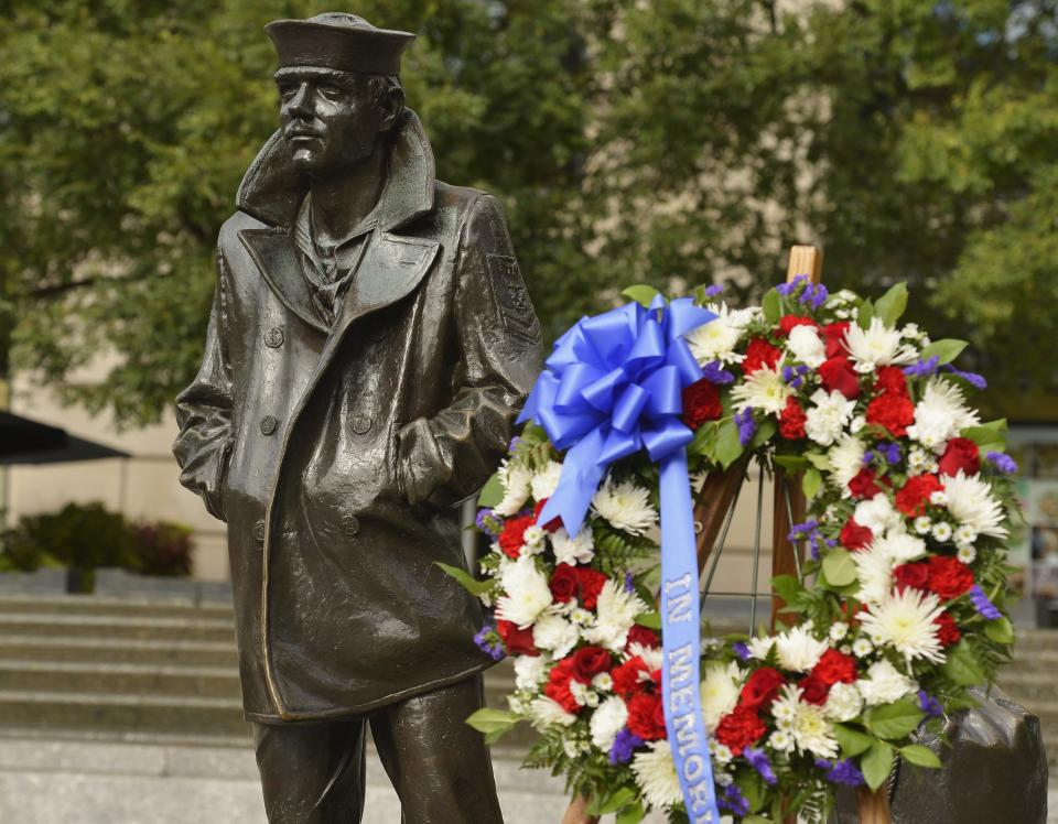 A wreath is left after a ceremony by military leaders, to honor the victims of the attack at the Navy Yard, at the Navy Memorial in Washington, September 17, 2013. Washington authorities questioned on Tuesday how a U.S. military veteran with a history of violence and mental problems could have gotten clearance to enter a Navy base where he killed 12 people before police shot him dead. The suspect, Aaron Alexis, 34, a Navy contractor from Fort Worth, Texas, entered Washington Navy Yard on Monday morning and opened fire, spreading panic at the base just a mile and a half (2.5 km) from the U.S. Capitol and three miles (4.8 km) from the White House. (REUTERS/Mike Theiler)