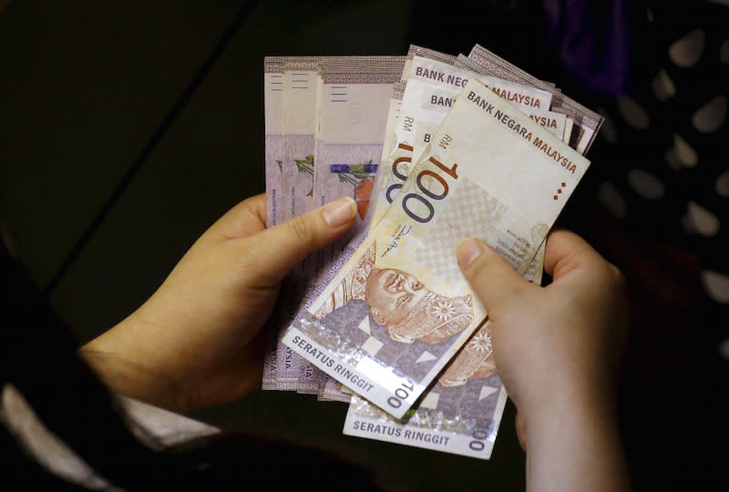 Sarawak Commercial Crimes Investigation Department (CCID) chief Mustafa Kamal Gani Abdullah said the woman lodged a report two days ago after finding only RM21 left in her bank account. — Reuters pic