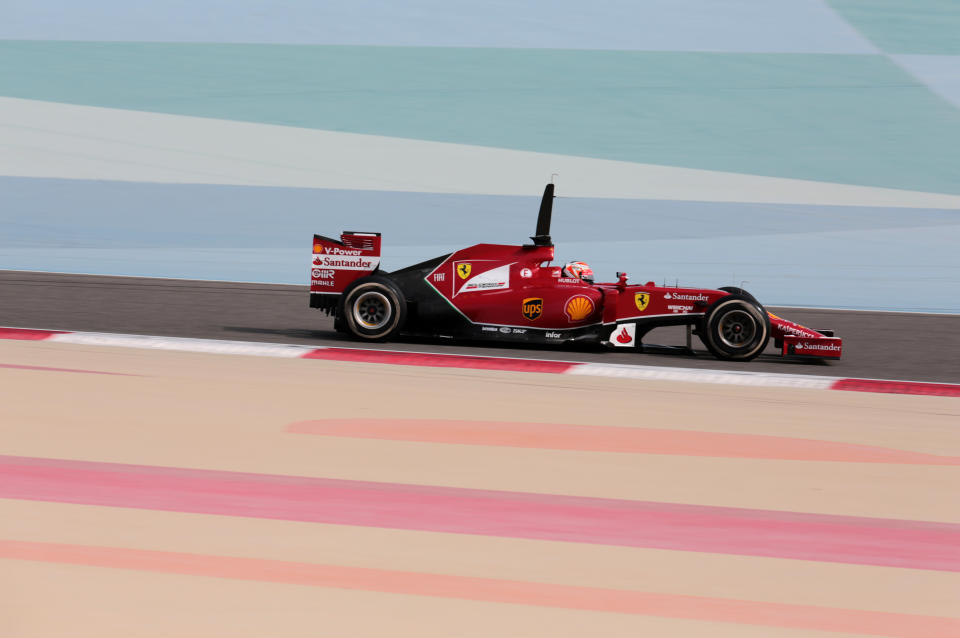 Formula One driver Kimi Raikkonen of Ferrari speeds down the track during pre-season testing at the Bahrain International Circuit in Sakhir, Bahrain, on Thursday, Feb. 27, 2014. (AP Photo/Hasan Jamali)