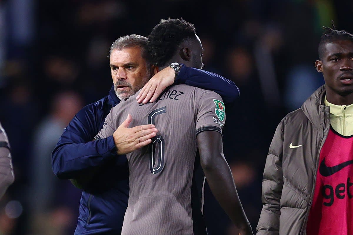 Penalty villain: Davinson Sanchez is consoled by Ange Postecoglou after his missed spot-kick saw Spurs lose at Fulham  (Getty Images)